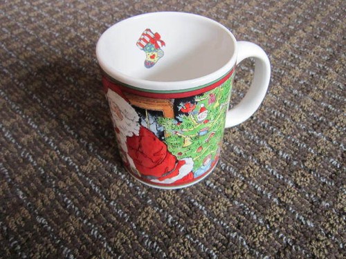 Santa filling stockings mug - filling,